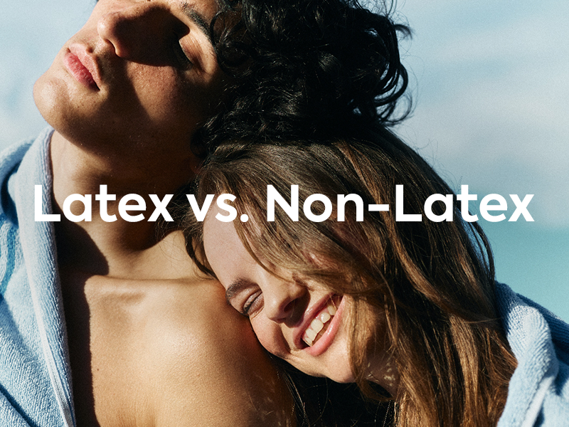 Image of happy couple at beach with text: Latex vs Non-Latex. Blog image for Latex vs. Non-Latex: What's the Difference? 